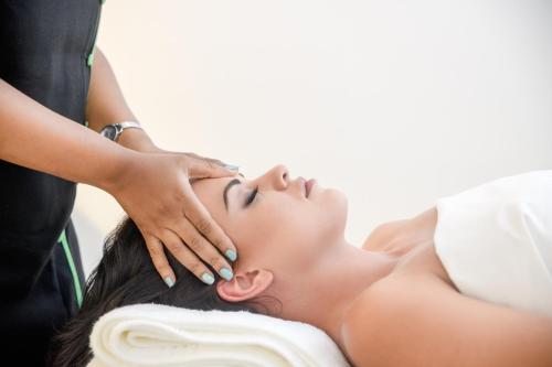 a woman getting a massage from a therapist at San Lameer Villa - 14014 - 5 Bedroom Luxury - 10 pax - San Lameer Rental Agency in Southbroom