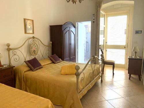 Llit o llits en una habitació de Bilocale Ugento Torre San Giovanni Casa Salento Holidays