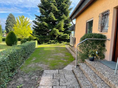 a house with a walkway leading into a yard at Sali Homes - SchaefersNest in Obersulm