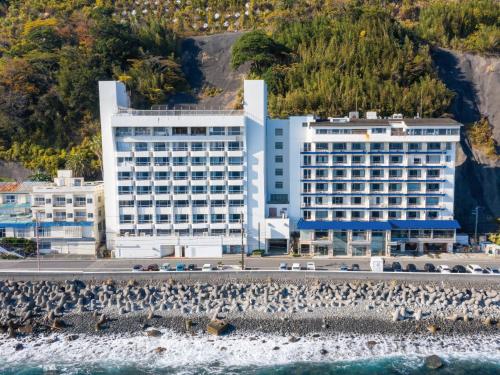 an aerial view of the hotel from the water at Atagawa Onsen Blue Ocean in Higashiizu