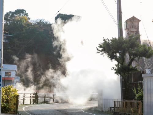 a pile of smoke on the side of a road at Atagawa Onsen Blue Ocean in Higashiizu