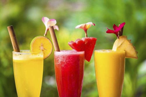 a group of three cocktails with fruit on top at Kubuku Eco Dive Lodge and Yoga in Pemuteran