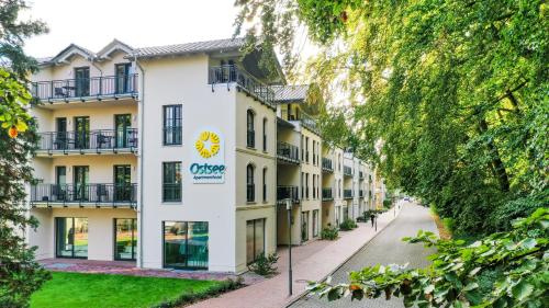 a building with a sign that reads ciceracio at Ostsee Apartmenthotel in Graal-Müritz