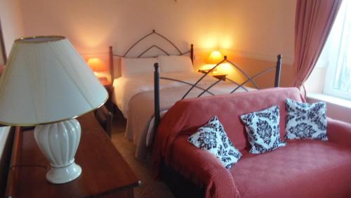 Postel nebo postele na pokoji v ubytování Caheroyn House
