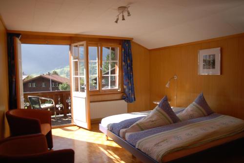 Säng eller sängar i ett rum på Chalet Tuftbach