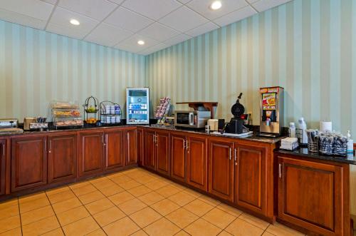 a coffee shop with wooden counters in a room at Best Western Staunton Inn in Staunton