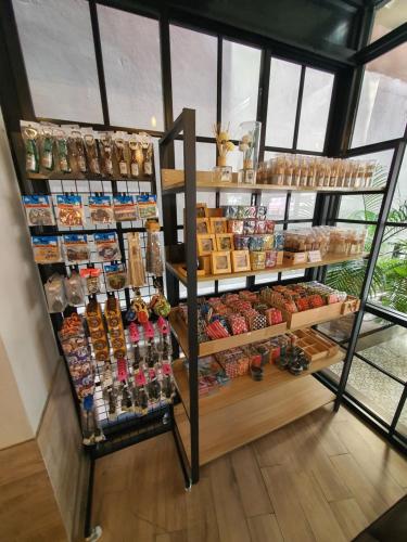a store with a shelf filled with different types of food at Let's Zzz Bangkok in Bangkok