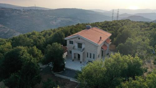 an aerial view of a house on a hill at Beit Mema in Aḑ Ḑahr