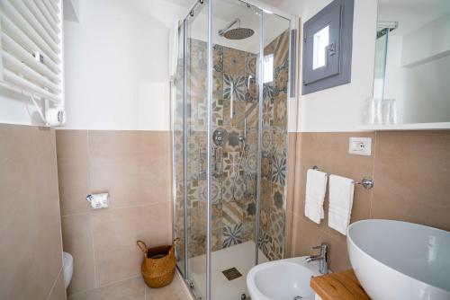 a bathroom with a shower and a sink and a toilet at Marianna 25 in Polignano a Mare