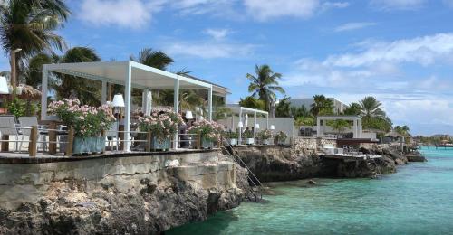 a restaurant on the shore of the water at Grand Windsock Bonaire in Kralendijk