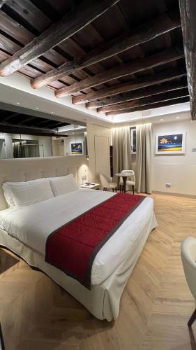 a large bedroom with a large bed in a room at Harry's Bar Trevi Hotel & Restaurant in Rome