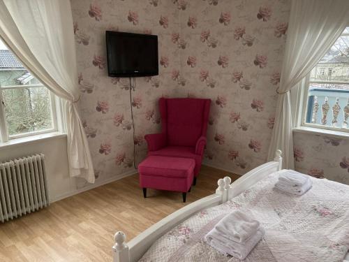Ένα ή περισσότερα κρεβάτια σε δωμάτιο στο Hotel Pensionat Granparken