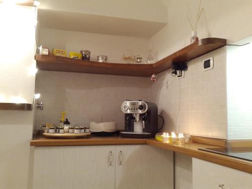 a kitchen with a coffee maker on a counter at Bed & Breakfast Al Ponte in Scanno