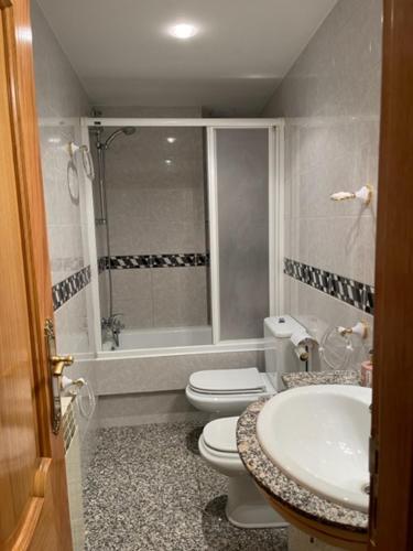 a bathroom with a toilet and a sink at Casa Conchita de Benasque in Benasque