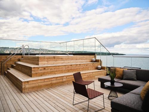 a deck with a couch and chairs on a boat at Quality Hotel Match in Jönköping