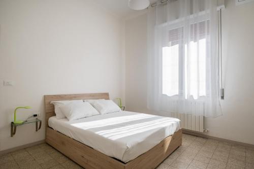 Tempat tidur dalam kamar di Bella Bologna by Wonderful Italy