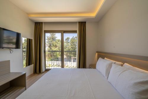Postel nebo postele na pokoji v ubytování OLİVE TREE HOTEL