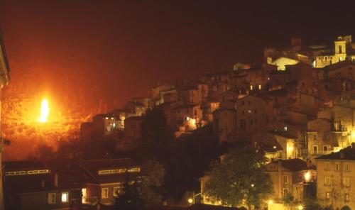 a city at night with a fire in the distance at Bed & Breakfast Al Ponte in Scanno
