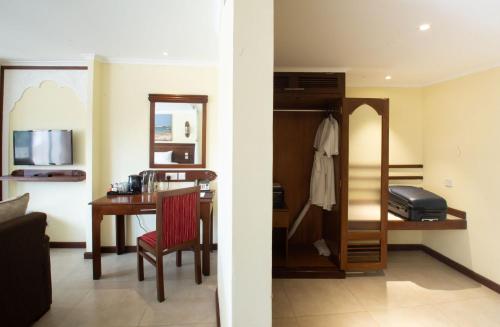 Ένα ή περισσότερα κρεβάτια σε δωμάτιο στο PrideInn Paradise Beach Resort & Spa Mombasa