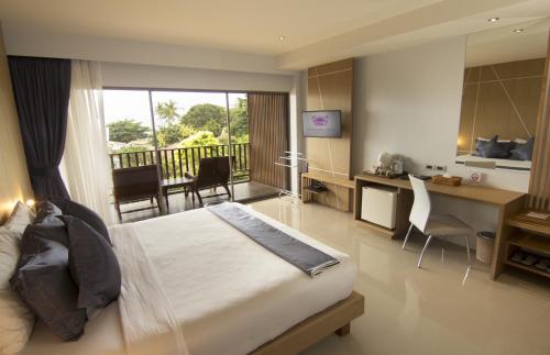 Chaweng Cove Beach Resortにあるベッド