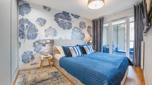 Postel nebo postele na pokoji v ubytování Blue Premium Kasprowicza 20B