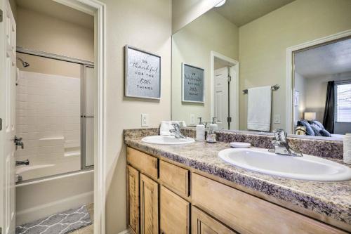 a bathroom with two sinks and a shower at Mesquite Desert Retreat Near Golf and Casinos! in Mesquite