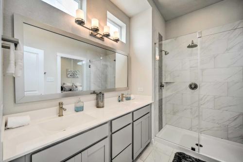 a bathroom with a sink and a shower and a mirror at Walkable San Antonio Getaway with Rooftop Patio in San Antonio