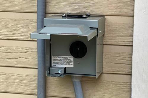 a security box on the side of a building at Lakefront Granbury Home with Dock, Decks and Hot Tub! in Granbury