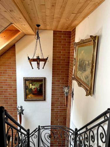 a chandelier hanging from a wall with a picture on a wall at Ferienwohnung Kleinkögeln in Kleinkögeln