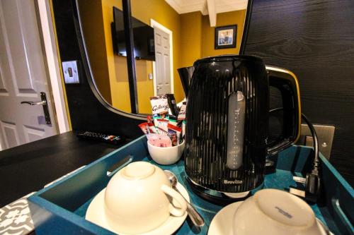 a kitchen counter with a blender on top of it at Three Horseshoes Leamside in Houghton le Spring