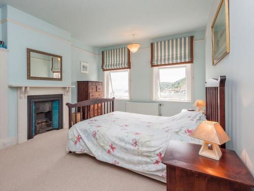 a bedroom with a bed and a fireplace at Mount Boone 12a in Dartmouth