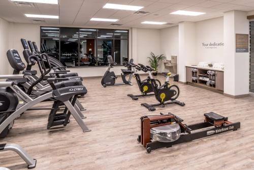 a gym with treadmills and elliptical machines at EVEN Hotel Eugene by IHG in Eugene