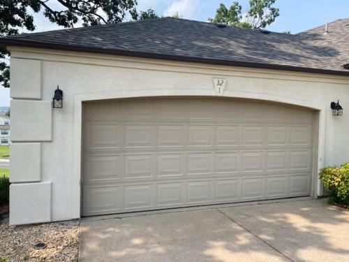 a white garage door with a driveway in a house at B 32-1 Spacious Villa Close to Pool in Branson