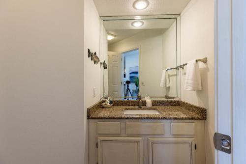 a bathroom with a sink and a large mirror at B 32-1 Spacious Villa Close to Pool in Branson