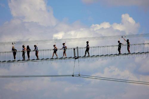 a group of people walking on an electric wire at B&B A casa di Carla in Castelsaraceno
