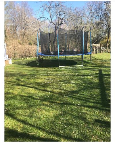 a swing set in a field of grass at Gästehaus Bönebüttel-nahe Neumünster Netflix in Bönebüttel