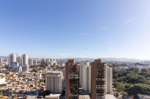 a view of a city with tall buildings at Urban Sky Studio - GRU in Guarulhos