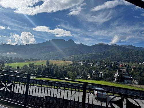a view of the mountains from a bridge at Good Morning Giewont & JACUZZI in Kościelisko