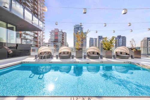 a large swimming pool on the roof of a building at Level Downtown - Howe in Vancouver