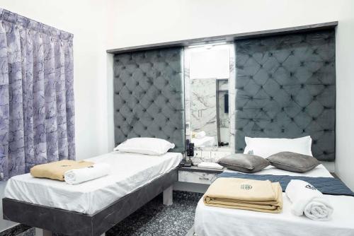 Postel nebo postele na pokoji v ubytování JSM Residency