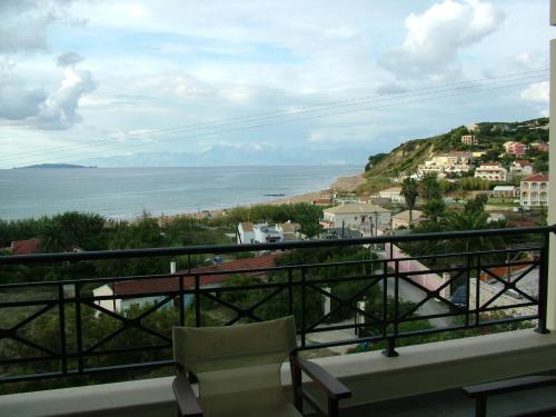 a view of the ocean from a balcony at Sugar and Almond in Agios Stefanos