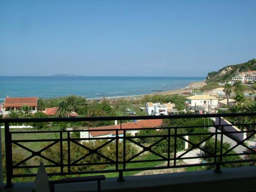 a view of the ocean from a balcony at Sugar and Almond in Agios Stefanos