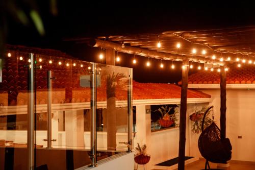 a string of lights on top of a house at Terra Inn Hotel Boutique in Guaduas