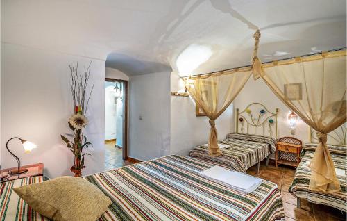 a bedroom with two beds in a room at Stunning Home In Cuevas Del Campo With House A Mountain View in Cuevas del Campo