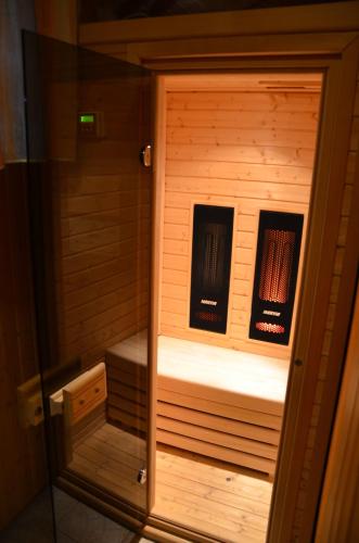 a sauna with two books inside of it at Hotel Villa Siesta in Smokovce