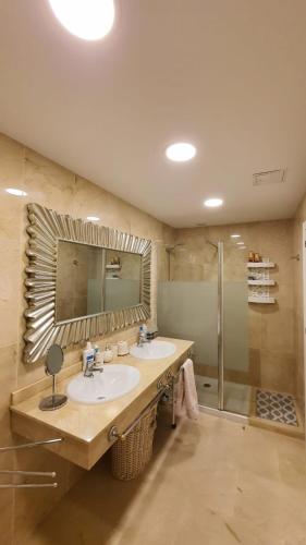 a bathroom with two sinks and a shower at Magnolia Luxury Apartment by AltamarHomes in Adeje