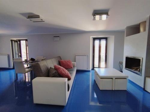 a living room with a couch and a table at Casa Vacanza "Marinella" in Sulmona