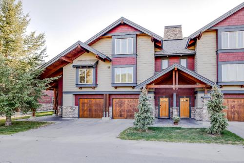 a large house with a garage at Pinnacle Ridge by FantasticStay in Fernie