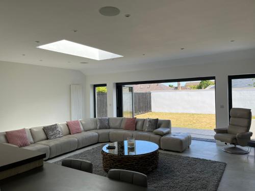 a living room with a couch and a table at Perfect 4 bedroom 2 bathroom Home in Edinburgh