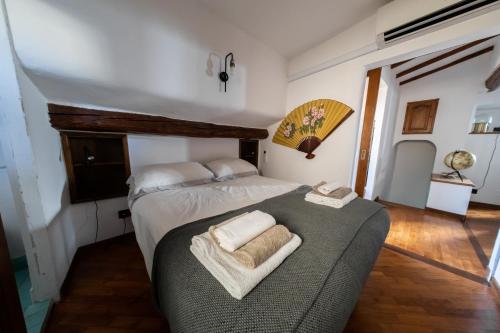 a bedroom with a bed and a couch in it at TINA’S APARTMENT in Florence